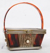 A 1950's vintage original Tyrolean tiger stripe lucite handbag.