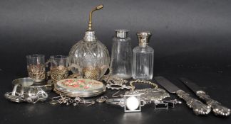 A collection of silver items and white metal items.