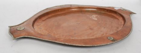 A large early 20th century silver and copper salver tray by AE Jones.