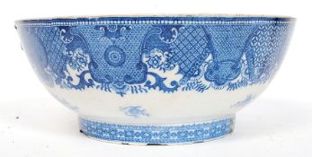 A Kang-xi Chinese blue and white fruit bowl having central pagoda scene having geometric borders (