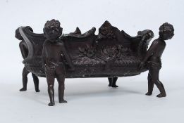 A believed 19th century bronze cherub centrepiece dish.