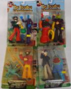 THE BEATLES: A set of 4x McFarlane Toys carded Beatles Yellow Submarine collectable action figures.