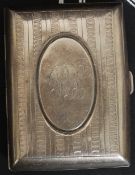 A silver hallmarked cigarette case with monogram to cartouche.