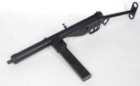 A DEACTIVATED MK III STEN SUB MACHINE GUN, with magazine, skeleton stock with sling, No B24446,