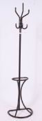A vintage retro tubular metal constructed coat / umbrella stand in brown.