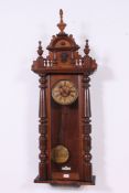 A 19th century large walnut cased vienna regulator wall clock in the manner of Gustav Becker.