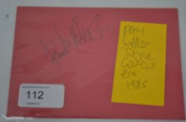 PAUL WELLER; An original signed red card by Paul Weller of ' The Jam ' fame,