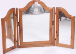 A pine dressing table triptych mirror by Ducal, lables to verso.