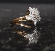 A ladies 9ct gold and diamond pave set flower head ring, the diamonds to each petal etc. Approx 4.
