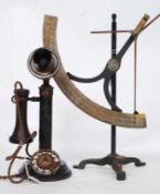 A vintage 20th century stick telephone together with ab unusual measure.