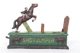 A cast iron money box bank in the form of a horse and jockey, with moving action.