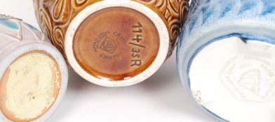Three retro studio pottery of varying sizes to include Celtic Ceramics,