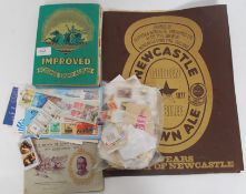 A stamp album with stamps dating from the early 20th century to include Southern Rhodesia, Russia,