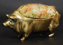 A good  19th century Victorian large brass pin cushion in the form of a pig. 87.2g.
