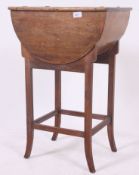 A fabulous mid century sewing box - workbox being raised on shaped legs with half cylinder box atop