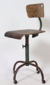 A good vintage industrial factory workers chair on tubular metal supports with bentwood seat,