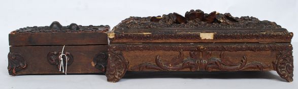 Two antique carved wooden topped caskets / boxes - each with carved form of flowers to top.