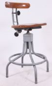 An excellent mid 20th century machinists chair with painted cast metal base with peripheral