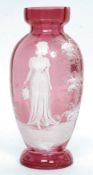 A Mary Gregory cranberry cameo vase.