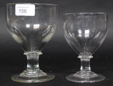 2 19th century lead crystal rummer glasses. One with large bowl, both with flat circular bases.