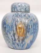 A Ruskin Pottery style drip glaze lustre  ginger jar and lid in blue and purples.