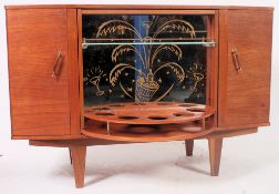 A retro 1960's Sureline teak sideboard - cocktail cabinet dresser having revolving centre section.
