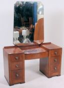 A 1930's Art Deco walnut dressing table chest of drawers.