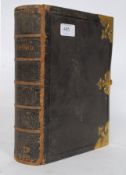 An antique bible, printed by George Eyre, bearing original brass clasps to exterior.