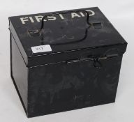 A mid 20th century ebonised First Aid tin, with notation in white to the top,