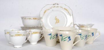 An Art Deco hand painted part tea service along with a part tea service titled ' Fantasia '