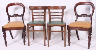 A pair of Victorian balloon back mahogany dining chairs being raised on turned legs united by