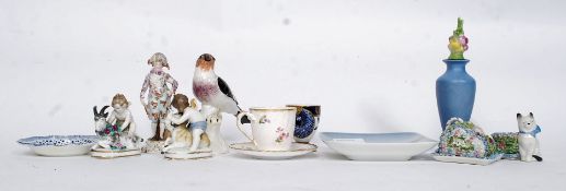 A collection of ceramics to include continental figurine with blue sword marks to base,