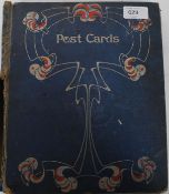 A vintage album containing a collection of early 20th century greeting cards to include silk,