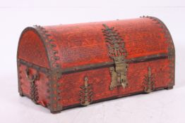 A decorative 20th century Armada dome top trunk chest with brass mounts and colourful decorated