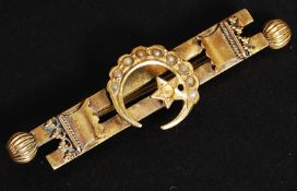 An 15ct ( tested ) Islamic brooch,