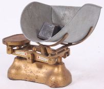 A pair of vintage 1950's W & T Avery grocers industrial scales complete with notation to centre,