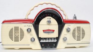 A Bush Radio cassette player The Overdrive model based on a 1950's car dash board in red and cream