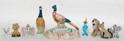 A Beswick pheasant ashtray along with some Wade wimsie figures