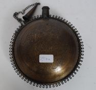 An Indian brass chase decorated moon flask with geometric patterns,