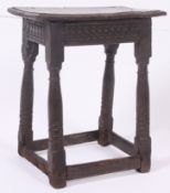 A believed 17th Century Oak Joint Stool. The plank top above a geometric carved frieze.