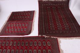 A collection of matching floor rugs / carpets of various sizes,