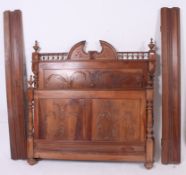 A 19th century carved French louis 16th style walnut double bed.