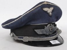 A 20th century German  Officers Cap with eagle cap badge and swastika being marked to the interior