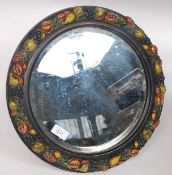 A circular early to mid 20th century  Barbola bevelled easel mirror decorated with painted fruits