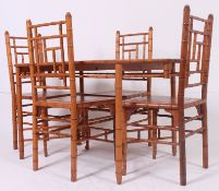A set of 4x chairs and table, each with a faux bamboo style.
