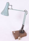 An original vintage Herbert Terry anglepoise work desk lamp, on an unusual faux wood laminated base.