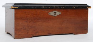 A 19th century Swiss musical / music box playing eight airs on a brass drum being set within a