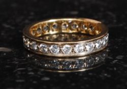An 18ct gold eternity ring with inset channel diamonds approx .50pnts.