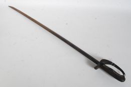 A 19th century cavalry sword with curved blade with impressed belived military marking to the