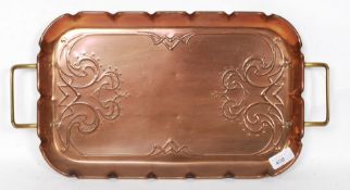 An art nouveau copper twin handled tray stamped JS & S to verso along with other copper wares